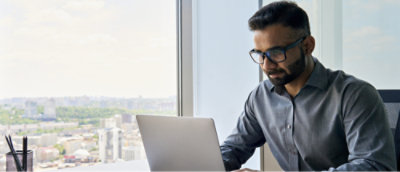 A person sitting at a desk with a computer