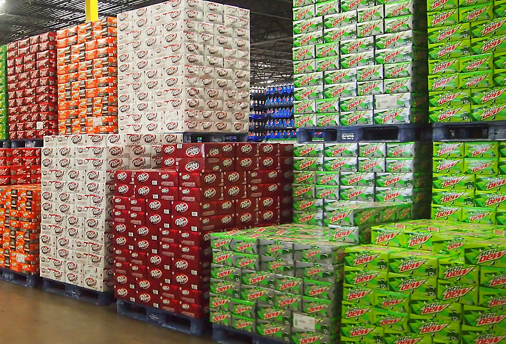 A large stack of soda boxes
