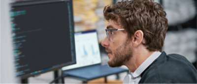 A person looking at a computer screen