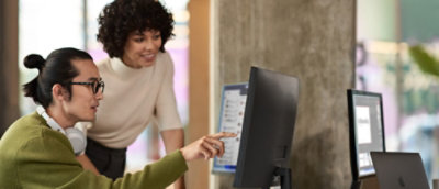 A man and a women working with a desktop