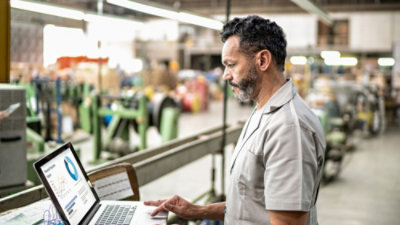 A man using a laptop.