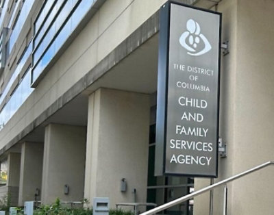 A sign on the front of a building displaying The District of Columbia Child and Family Services Agency.