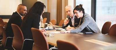 A group of people sitting at a table.