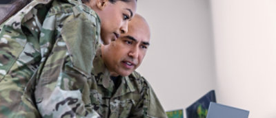 A man and women looking at screen.