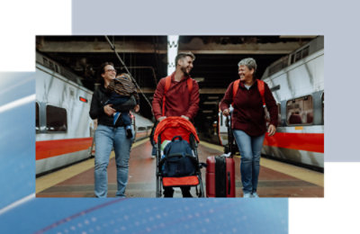 A group of people walking with luggage.
