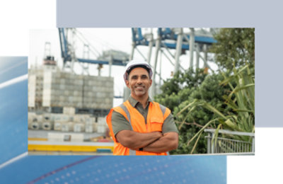 A person wearing a safety vest is visible.