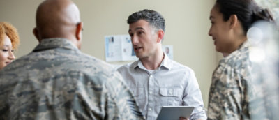 A group of people talking with eatch other.