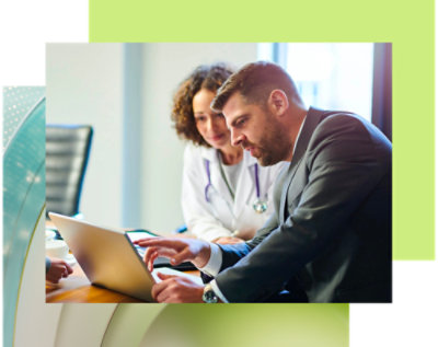 A group of people looking at a laptop.