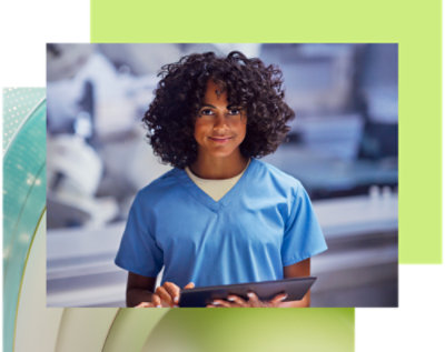 A person in blue scrubs holding a tablet.