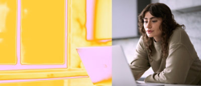 a close-up of a Woman looking at a laptop.