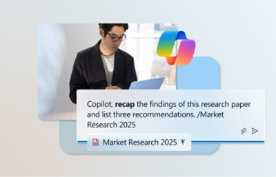 A man looking at a laptop displaying text about research findings.