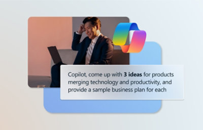 A man sitting on a couch with a laptop.