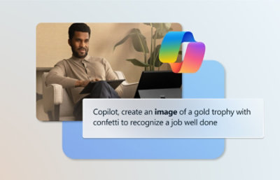 A man sitting in a chair with a laptop.
