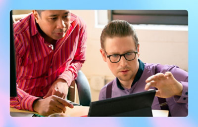 A man in glasses using a tablet.