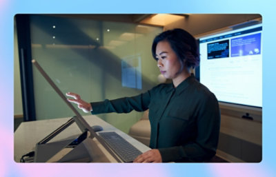 A woman using a touch screen.