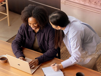 A woman looking at a laptop