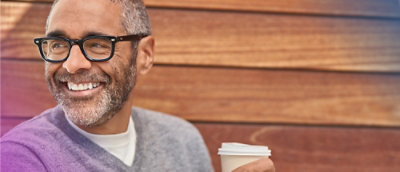 A person with spects smiling