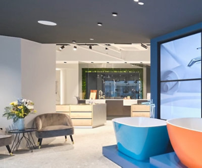 A room with a tub and a chair.