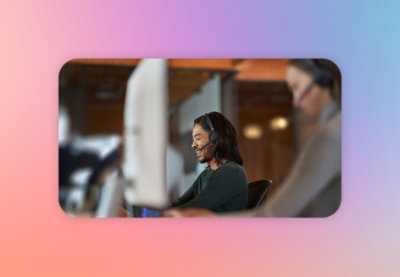 A man wearing headphones and working on a laptop.