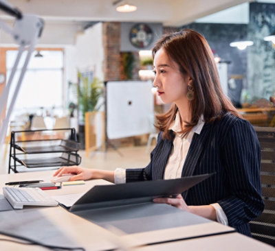  A woman sitting at a desk.