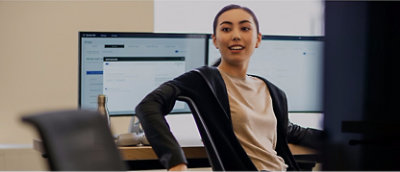 A woman sitting in front of a computer.