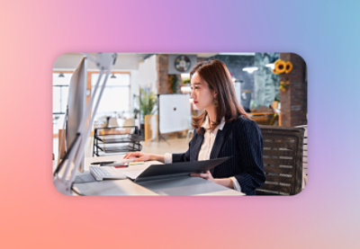 A woman sitting at a desk.