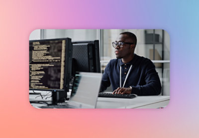 A man sitting at a desk with a computer.