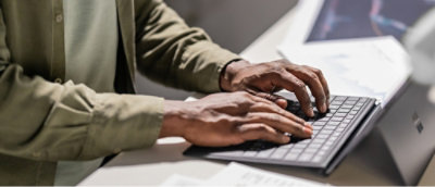 A person typing on a keyboard