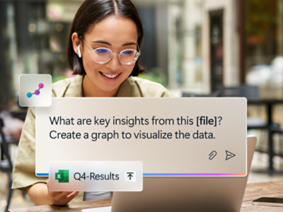 A person wearing glasses and earbuds looking at a laptop screen with text displayed.