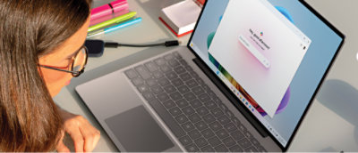 a laptop with a keyboard and a book