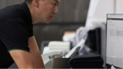 A man looking at a laptop.