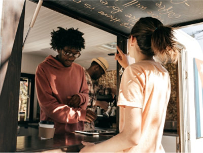 A group of people standing in front of a blackboard.