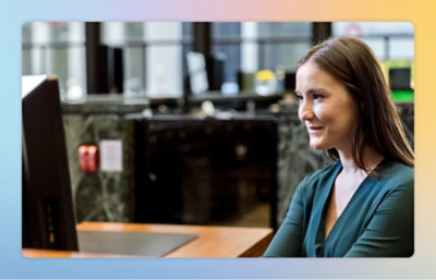 a woman looking at a computer screen