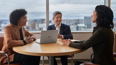 A group of people talking together in office desk.786