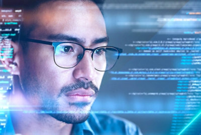 A close up of a man wearing glasses