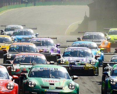 A green race car with the number 999 and Mobil logo on the windshield.