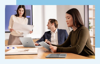three people discussing in the conference room