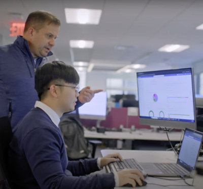 Aerial view of a large bimbo bakery facility with branded warehouses, surrounded by urban landscape.