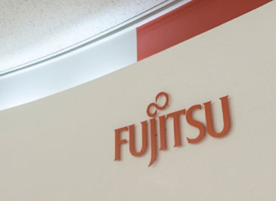 A close-up of a red and white wall with the text FUJITSU visible.