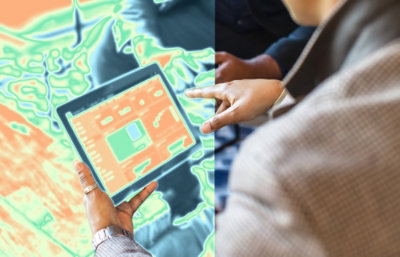 A close-up of a person's hand pointing at a tablet.