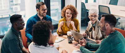 group of people sitting and discussing something
