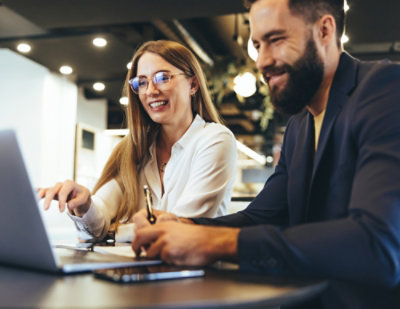  A man and women smiling each other.