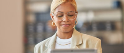 A person wearing glasses and a white shirt.