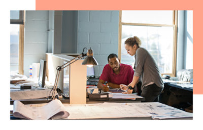 Two people engaged in a lively conversation. One person is wearing red tshirt