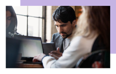 A man is working on a laptop.