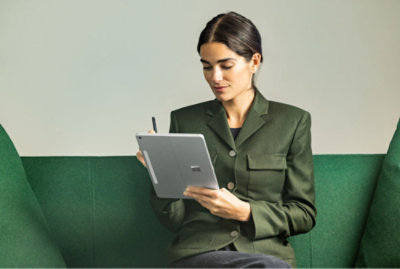 A women typing on a tablet