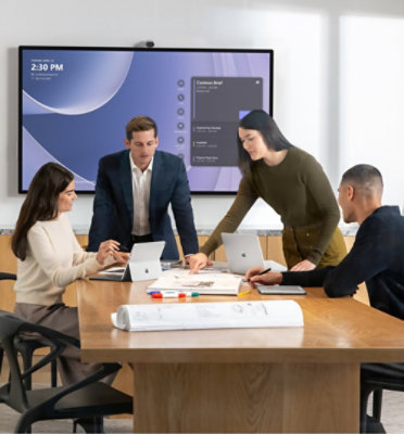 Group of people discussing something with their tablets on a table