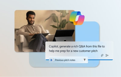 A man sitting in a chair with a laptop.