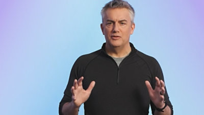 A person standing and explaining on screen