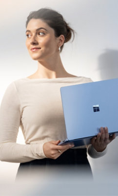 A person holding a laptop.